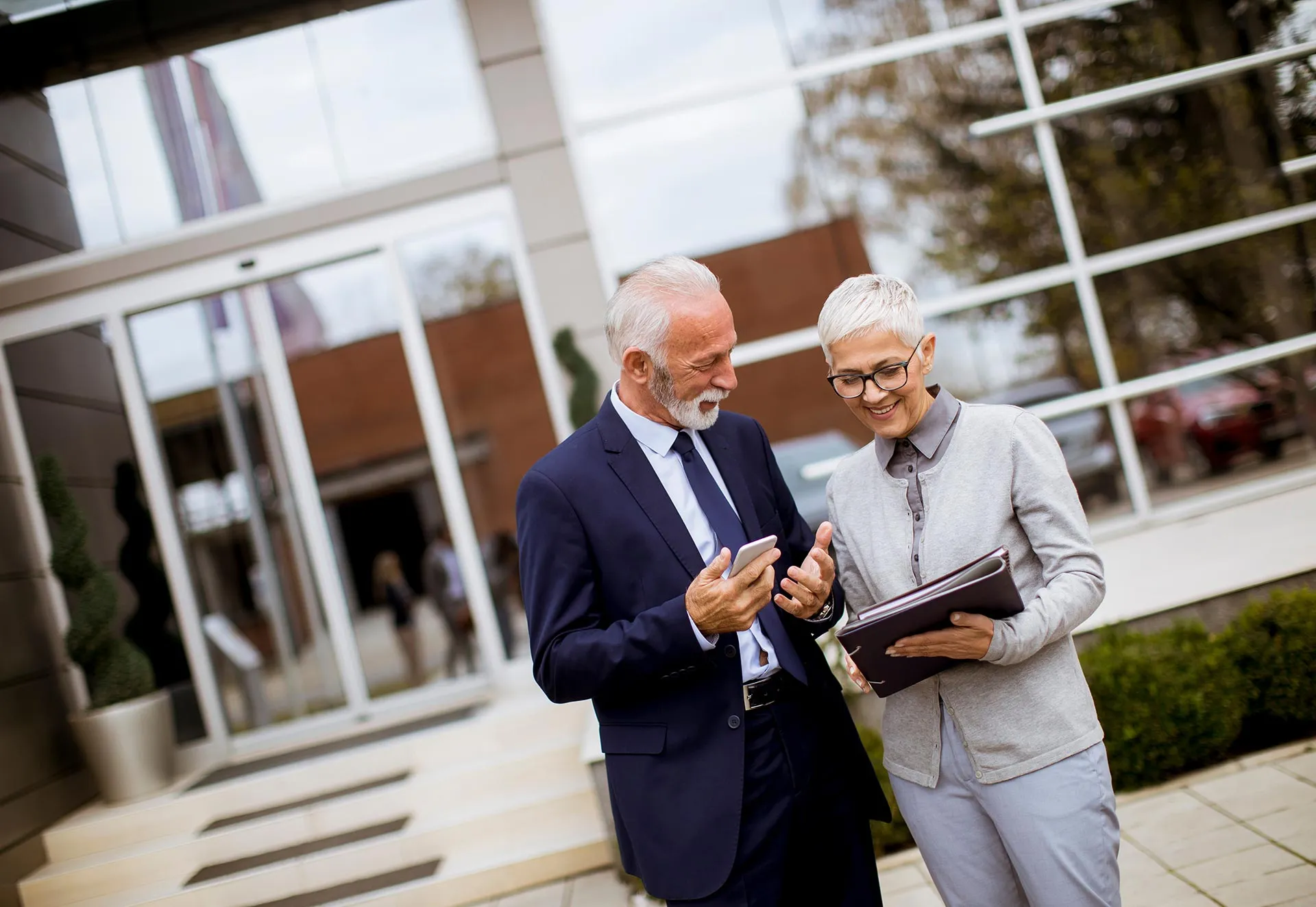 Senior Business People Talking and Discussing Outdoors